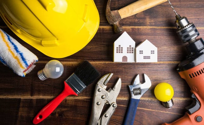Maintenance tools around a wooden model house