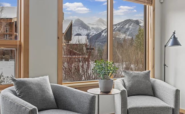 Mountain view from a window at a Rise Co-Host property in Canmore